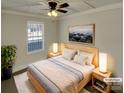 Virtually staged main bedroom with a ceiling fan and large window at 4210 Manchester Ln, Monroe, NC 28110