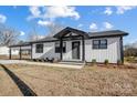 White and black modern farmhouse exterior at 516 Spring Garden Ave, Kannapolis, NC 28081