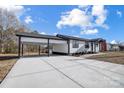 Newly renovated home with carport and landscaping at 516 Spring Garden Ave, Kannapolis, NC 28081