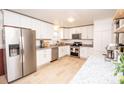 Modern kitchen with stainless steel appliances and white cabinets at 820 Kerley Ct, Statesville, NC 28677