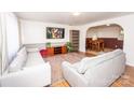 Bright living room featuring hardwood floors and a wood entertainment center at 820 Kerley Ct, Statesville, NC 28677
