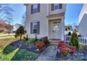 Charming front yard with landscaping and white picket fence at 11231 Heritage Green Dr, Cornelius, NC 28031