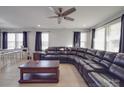 Living room with sectional sofa, coffee table, and hardwood floors at 114 W Lee Ave, Bessemer City, NC 28016