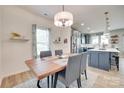 Elegant dining room with modern lighting and an open view to the kitchen, perfect for entertaining at 15298 Windward Ln, Lancaster, SC 29720