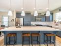 Modern kitchen featuring an island with seating and sleek cabinetry at 15298 Windward Ln, Lancaster, SC 29720