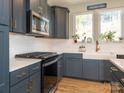 Modern kitchen with white subway tile backsplash and stainless steel appliances at 15298 Windward Ln, Lancaster, SC 29720