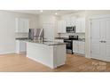 Kitchen with white cabinets, granite countertops, and stainless steel appliances at 1530 Doran Ter, Richburg, SC 29729