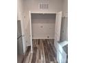 Laundry room with white doors and wire shelving at 1827 Mcdonald St, Charlotte, NC 28216