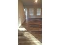 Bright living room with hardwood floors and sunlight streaming through the windows at 1827 Mcdonald St, Charlotte, NC 28216