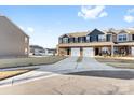 Townhome with gray siding, two-car garage, and driveway, in a residential neighborhood at 543 San Marco Dr # 16, Gastonia, NC 28056
