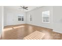 Bright living room with hardwood floors, neutral walls, and plenty of natural light at 543 San Marco Dr # 16, Gastonia, NC 28056