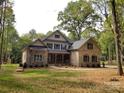 A spacious home with a combination of brick and stone, complemented by a well-manicured lawn and mature trees at 6507 Rehobeth Rd # 4, Waxhaw, NC 28173