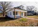 Renovated cottage, side view showcasing architectural details and landscaping at 906 Church St, Kings Mountain, NC 28086