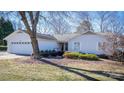 Single-story home with attached garage and landscaping at 130 Sandy Shore Dr, Mooresville, NC 28117