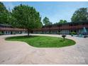 Relaxing courtyard featuring green space, comfortable seating, and an inviting outdoor ambiance at 2000 Patio Ct # 129, Charlotte, NC 28205