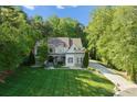 Luxury home with manicured lawn and tree-lined property at 227 Wildwood Cove Dr, Mooresville, NC 28117