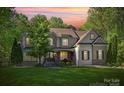 Two-story house with stone accents and landscaped lawn at 227 Wildwood Cove Dr, Mooresville, NC 28117
