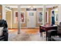 Inviting entryway with hardwood floors and white front door at 3406 Red Fox Trl, Weddington, NC 28104