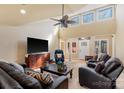 Open living area with vaulted ceilings, leather furniture and large windows at 3406 Red Fox Trl, Weddington, NC 28104