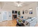 Living room with sectional sofa and brick fireplace at 758 Emerson Dr, Mooresville, NC 28115