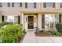 Inviting front entrance with landscaping and a walkway at 8244 Fox Swamp Rd, Charlotte, NC 28215