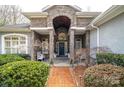Stone front porch with blue door and landscaping at 104 Cramer Mountain Woods None, Cramerton, NC 28032