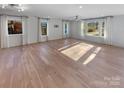 Spacious living area featuring hardwood floors and abundant natural light at 1201 Pierson Dr, Charlotte, NC 28205