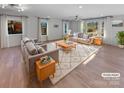 Bright and airy living room with hardwood floors and large windows at 1201 Pierson Dr, Charlotte, NC 28205