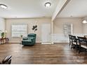 Living room with hardwood floors and large windows at 1255 Tranquil Falls Ln, Matthews, NC 28104