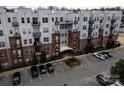 An apartment building with parking and surrounding landscape at 2338 Yadkin Ave # 203, Charlotte, NC 28205