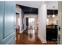 Open concept entryway with dining area and dark stained concrete floors at 2338 Yadkin Ave # 203, Charlotte, NC 28205
