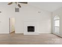 Bright living room with vaulted ceilings, fireplace, and hardwood floors at 9004 English Saddle Ln, Charlotte, NC 28273