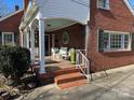 Inviting front porch with tiled floor and seating at 916 Maple Ave, Salisbury, NC 28144