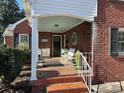 Inviting front porch with tiled floor and seating at 916 Maple Ave, Salisbury, NC 28144