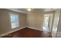 Hardwood floor bedroom with access to another room at 110 Fall Hollow Ln, Troutman, NC 28166