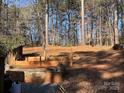 Landscaped backyard with tiered retaining walls at 119 Creek View Rd, Mooresville, NC 28117