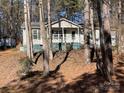 House exterior showcasing a front porch and large trees at 119 Creek View Rd, Mooresville, NC 28117