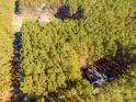 Aerial view showcasing home's wooded setting and location at 165 Pine Valley Dr, Stanley, NC 28164