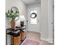 Entryway with console table, mirror, and soft rug at 1729 Nia Rd, Charlotte, NC 28215