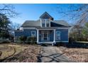 Two-story home with a gray exterior and white trim at 302 S College St, Monroe, NC 28112