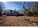 Spacious yard with mature trees and landscaping at 302 S College St, Monroe, NC 28112