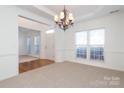 Spacious dining room featuring a chandelier and hardwood floors at 4030 Garden Oak Dr, Indian Trail, NC 28079