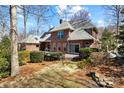 This beautiful back exterior offers an expansive backyard with a patio perfect for entertaining guests at 411 Major Run, Cramerton, NC 28032