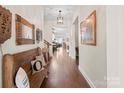 Bright entryway with hardwood floors, a bench, and view to living area at 4722 Looking Glass Trl, Denver, NC 28037