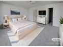 Virtually staged main bedroom with ensuite bathroom and walk-in closet at 495 Drumstand Rd, Stony Point, NC 28678