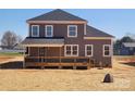 Backyard with wood porch featuring immature landscaping at 8078 Blackwood Rd, Denver, NC 28037