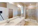 Main bathroom with double sinks, shower and walk-in closet at 8101 Jacey Ln # 38, Huntersville, NC 28078