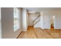Bright and spacious entryway with hardwood floors and staircase at 8101 Jacey Ln # 38, Huntersville, NC 28078
