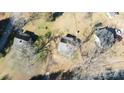Aerial view of three houses on a lot with leafless trees and cars parked nearby at 1024 Chester Ave, Great Falls, SC 29055