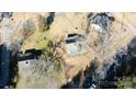 High-angle view showcasing three houses on a property with leafless trees at 1024 Chester Ave, Great Falls, SC 29055